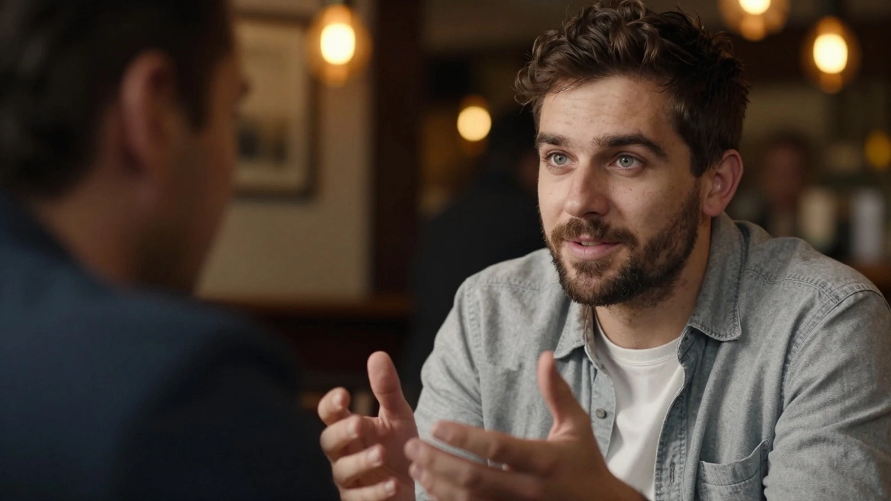Close-up of a man listening attentively to another in a pub